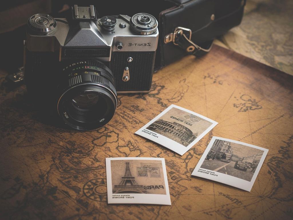 Inspirational team working outdoors with travel maps