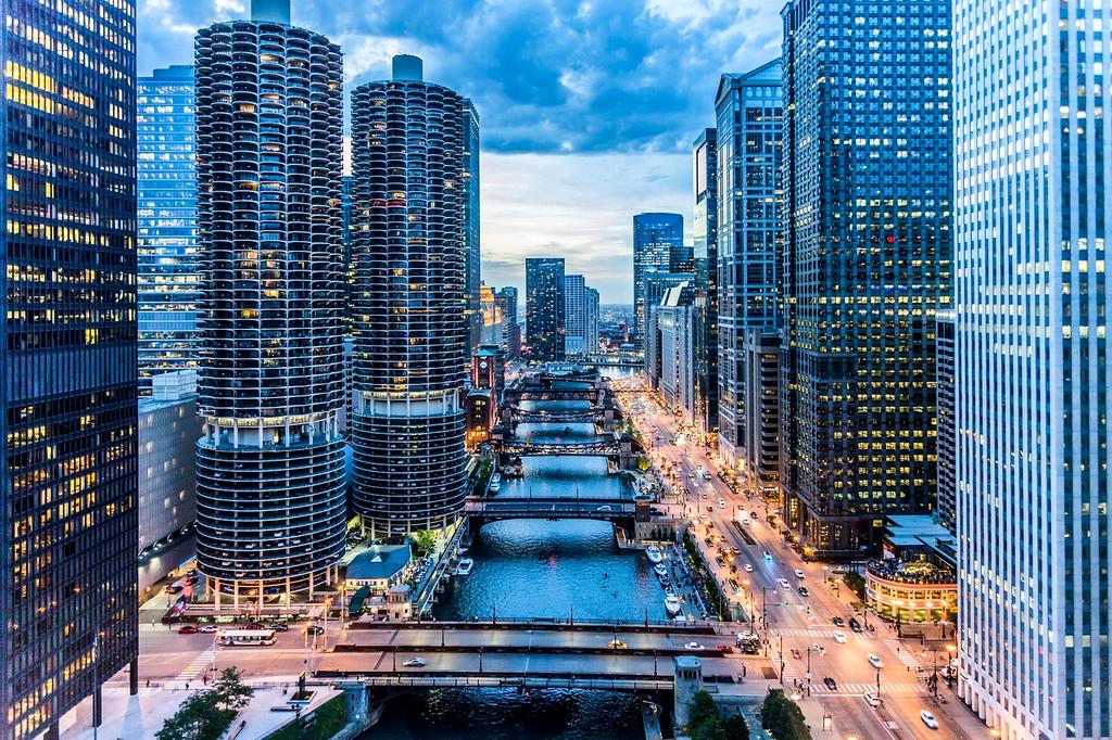Night city skyline view from hotel balcony with vibrant lights