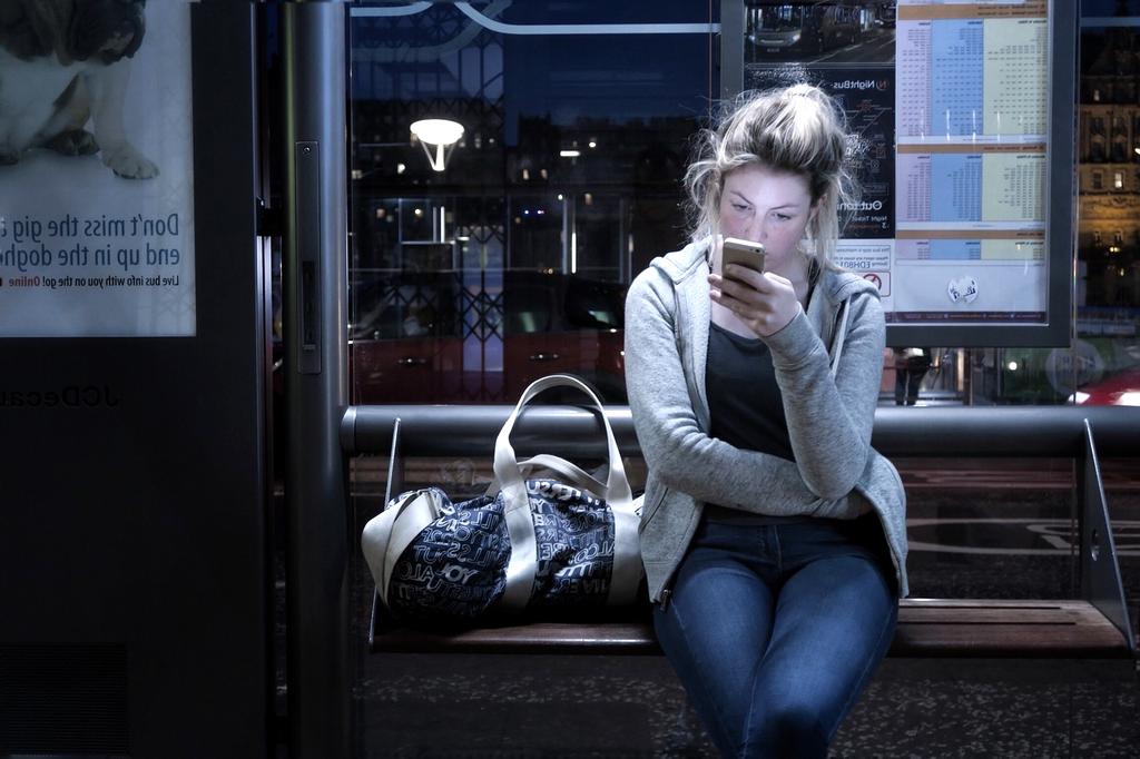 Traveler checking last minute deals on a smartphone