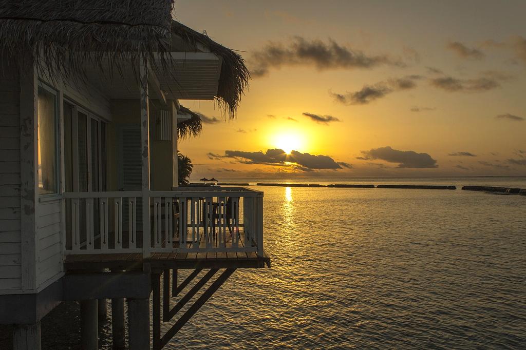 Luxurious overwater bungalows with turquoise waters underneath
