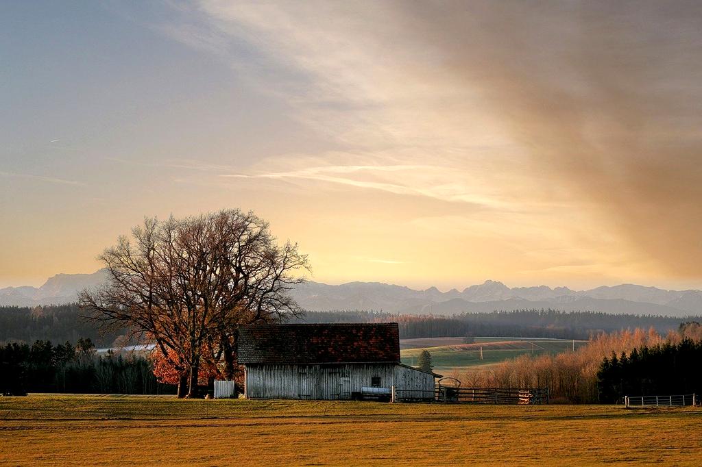 Couple enjoying sunset at a cozy lakeside cabin